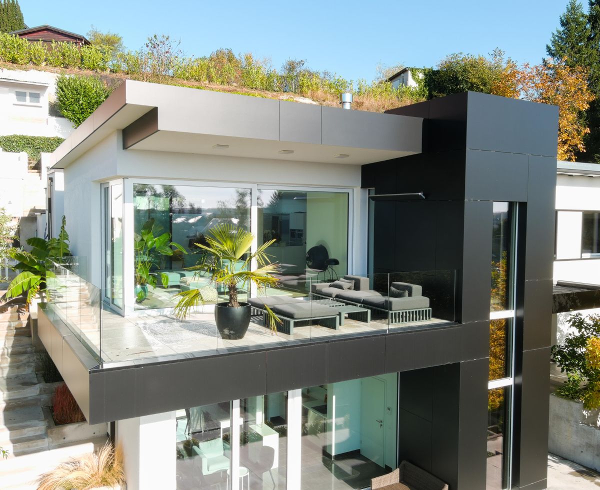 A modern city house with balcony and terrace, perfect for urban living.